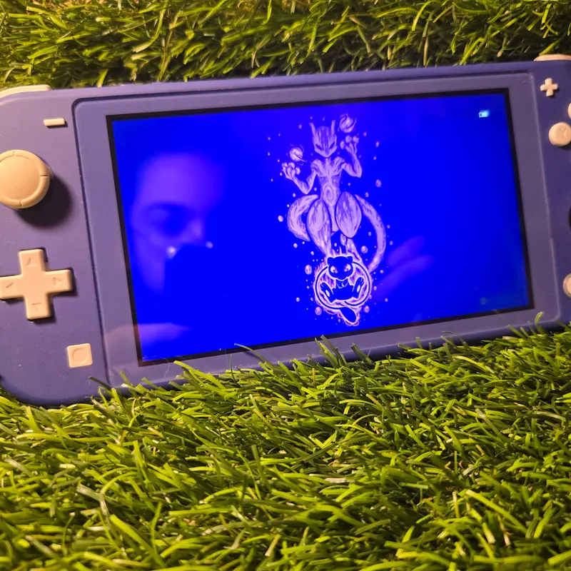 Nintendo Switch Lite bleue avec sa boîte d'origine