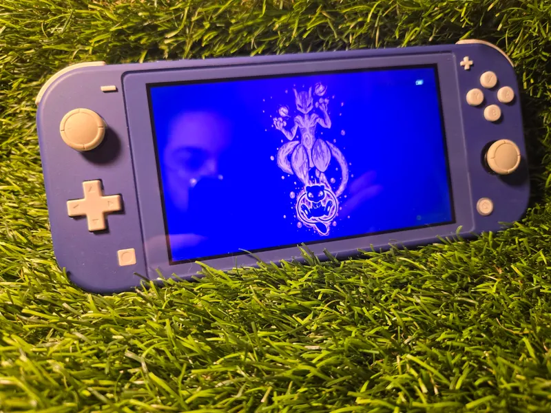 Nintendo Switch Lite bleue avec sa boîte d'origine
