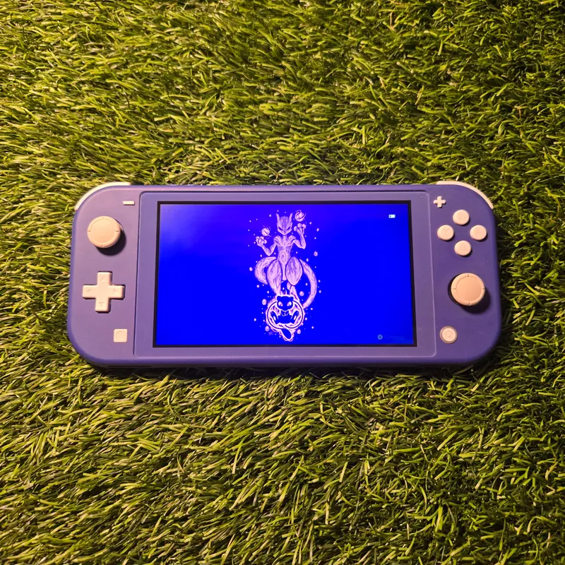 Switch Lite bleue et son chargeur d'origine